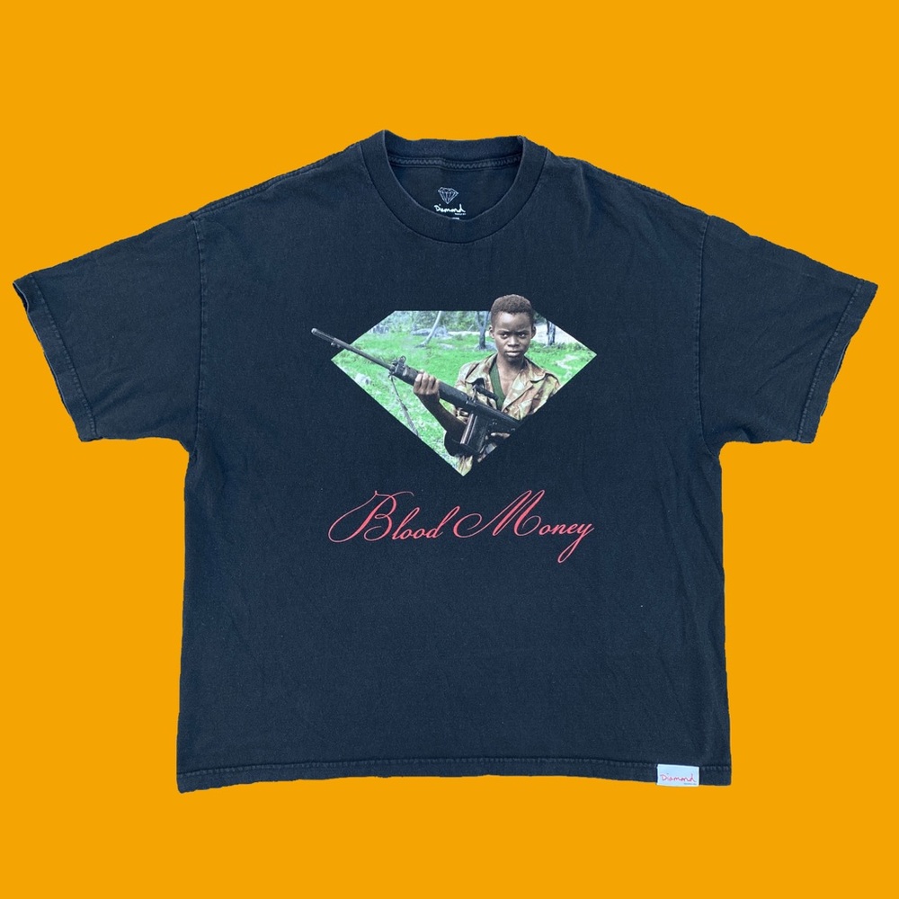 Diamond gun in hand tee